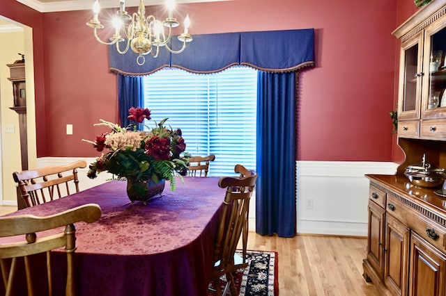 dining area featuring an inviting chandelier and light wood finished floors