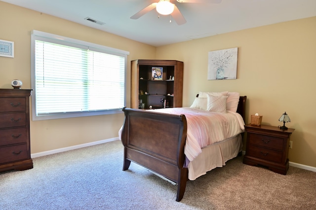 bedroom with a ceiling fan, carpet, visible vents, and baseboards