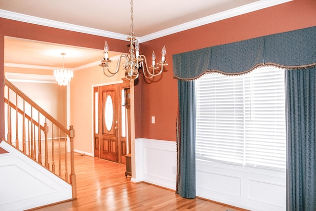 415 David Ln, Winchester, KY 40391 - foyer with a chandelier, wood finished floors, crown molding, plenty of natural light, and stairway