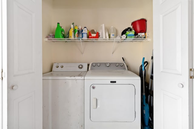 clothes washing area with laundry area and washing machine and clothes dryer