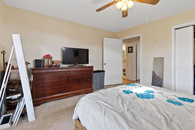 bedroom featuring ceiling fan and light colored carpet