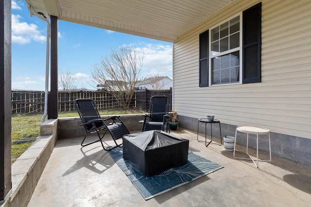 view of patio / terrace with an outdoor fire pit and a fenced backyard