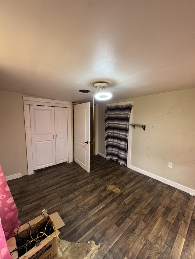 1809 Exeter Ave, Middlesboro, KY 40965 - unfurnished living room featuring dark wood-style flooring and baseboards
