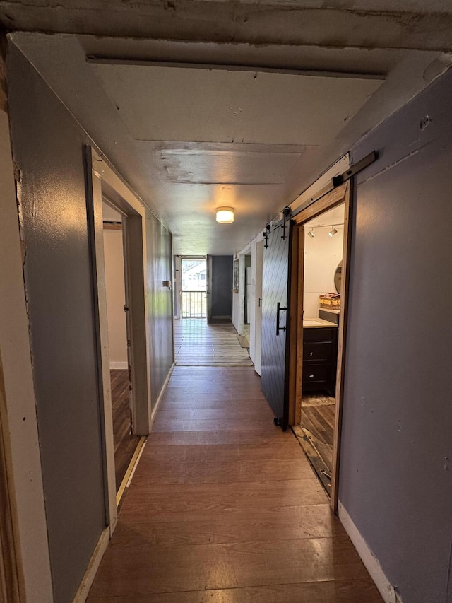1809 Exeter Ave, Middlesboro, KY 40965 - hall with wood-type flooring, baseboards, and a barn door
