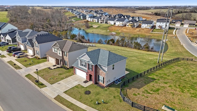 aerial view with a residential view and a water view