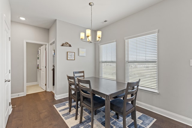 dining area with visible vents, recessed lighting, an inviting chandelier, baseboards, and dark wood-style flooring