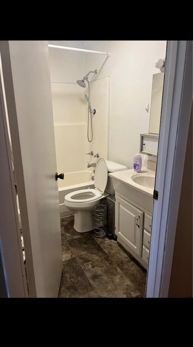 bathroom featuring  shower combination, vanity, and toilet