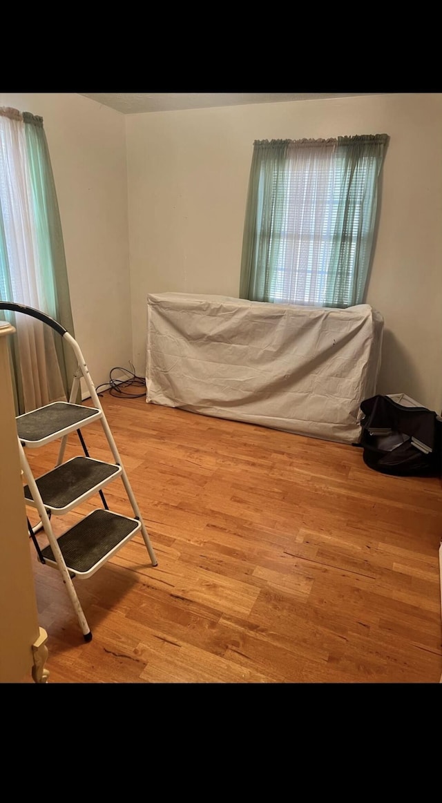 bedroom featuring wood finished floors