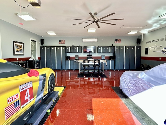 bedroom featuring a garage, attic access, and a wall mounted AC