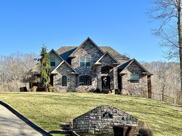 view of front of home featuring a front yard and fence