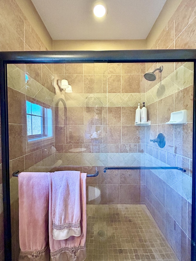 bathroom with a shower stall