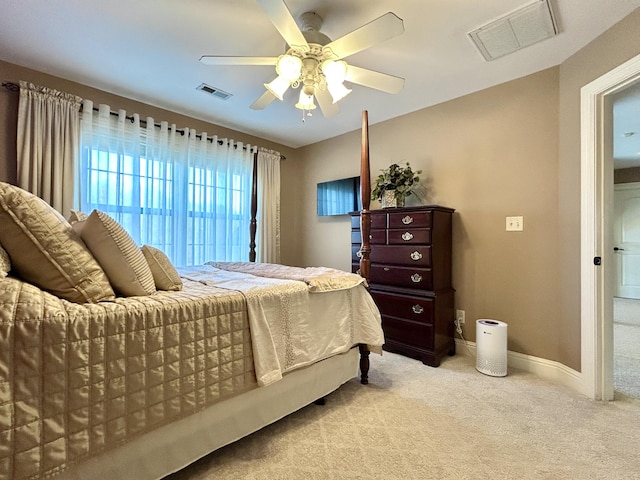 bedroom featuring carpet floors, visible vents, and baseboards