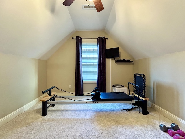 exercise area with vaulted ceiling, carpet flooring, visible vents, and baseboards