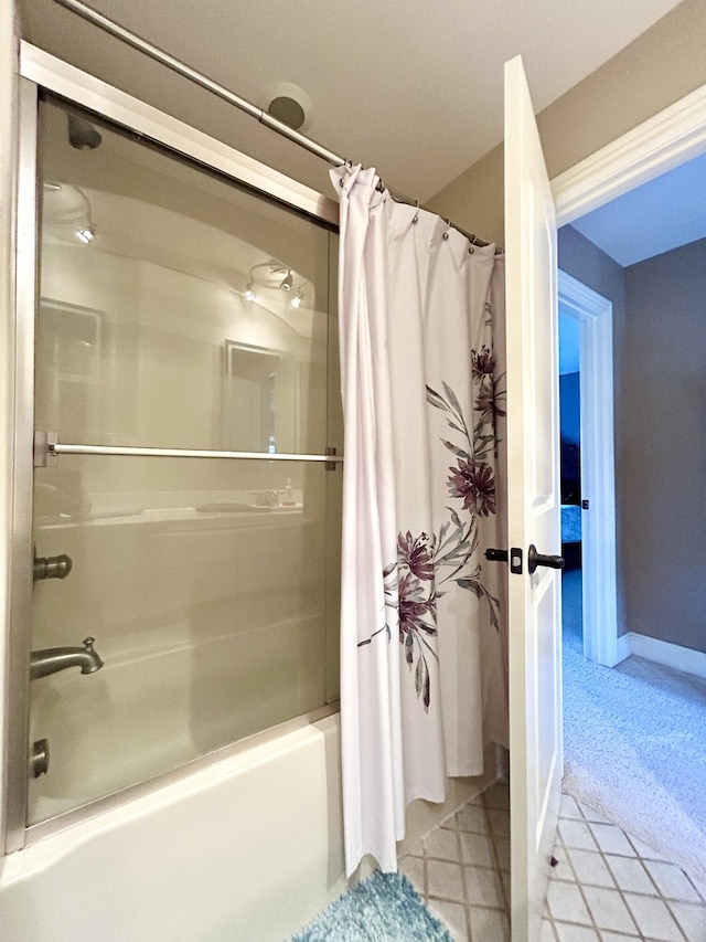 full bath with baseboards and shower / tub combo with curtain