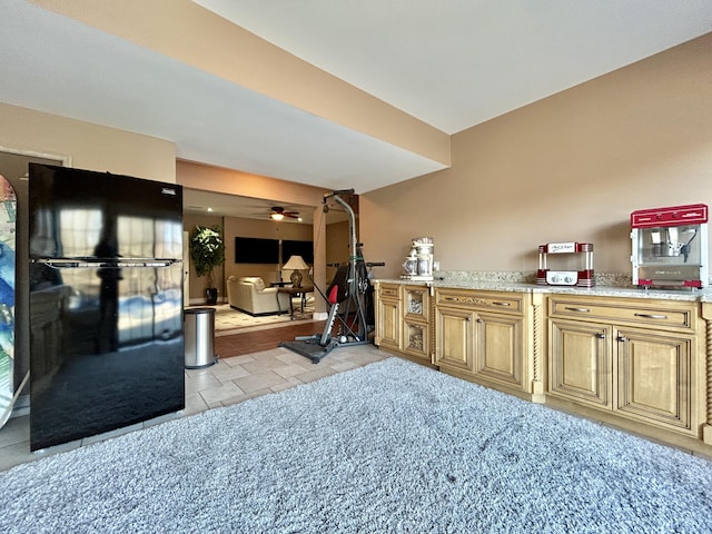 kitchen featuring light tile patterned floors and light countertops