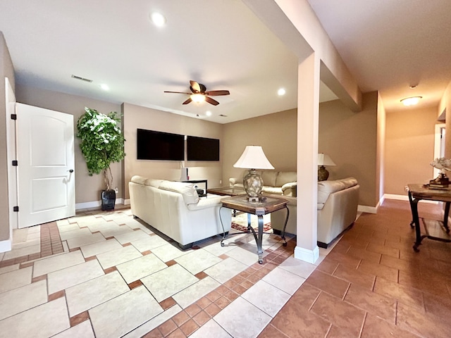 living room with light tile patterned floors, ceiling fan, baseboards, and recessed lighting