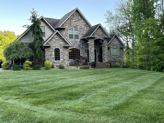 craftsman-style house with a front yard