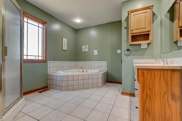 full bathroom featuring baseboards, a shower with shower door, tile patterned floors, a garden tub, and vanity