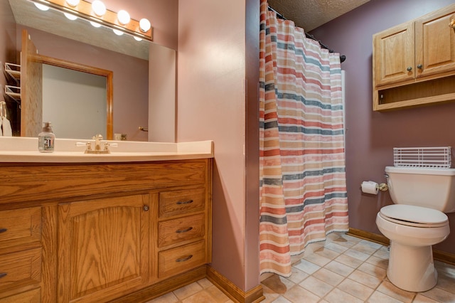 full bathroom with baseboards, toilet, curtained shower, tile patterned flooring, and vanity