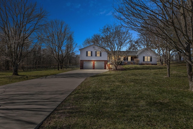 view of front of property with a garage, brick siding, fence, concrete driveway, and a front yard