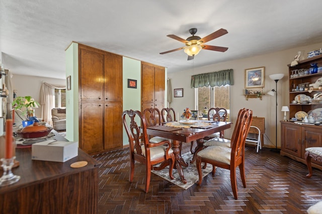 dining area with ceiling fan