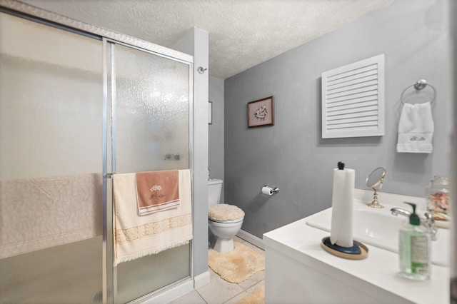 full bath with toilet, tile patterned flooring, a shower stall, and a textured ceiling