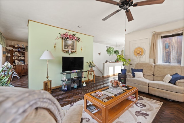 living area with a ceiling fan