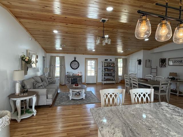 living room with wood ceiling, wood finished floors, and vaulted ceiling