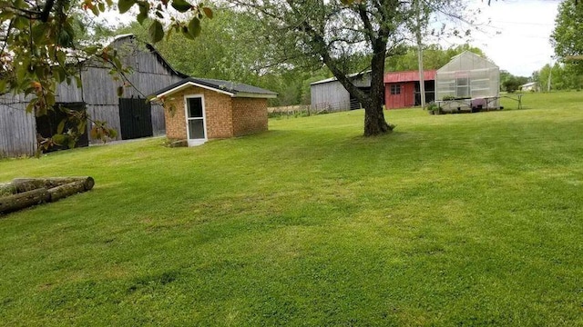 view of yard with an exterior structure and an outdoor structure