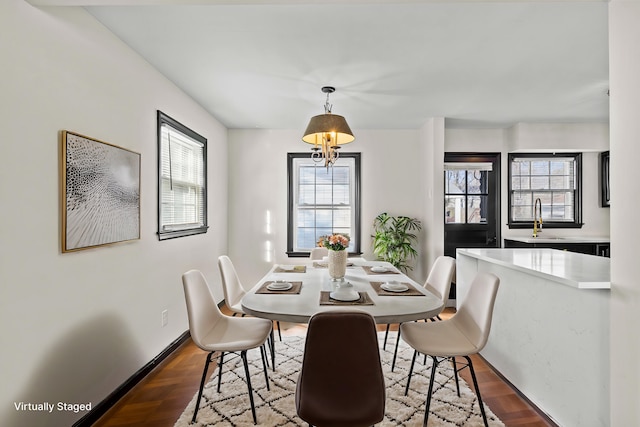 dining room featuring baseboards