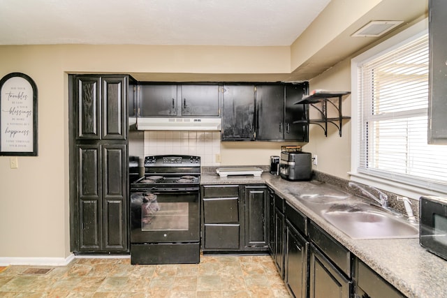 kitchen with open shelves, a sink, dark cabinets, under cabinet range hood, and black appliances