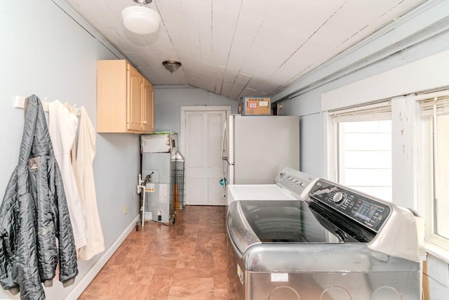 laundry area featuring cabinet space and washing machine and clothes dryer