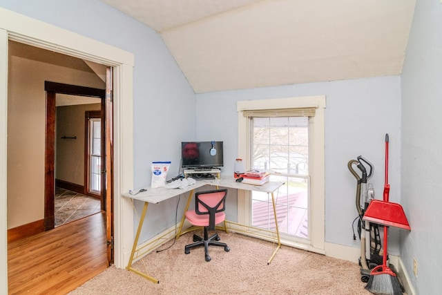 home office with lofted ceiling, wood finished floors, and baseboards