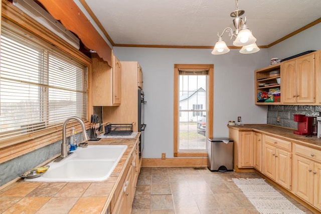 kitchen featuring tile counters, decorative backsplash, light brown cabinets, open shelves, and a sink