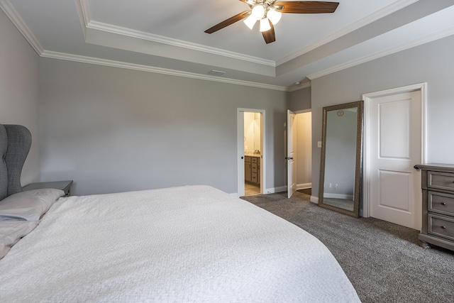 bedroom with baseboards, a tray ceiling, carpet, and crown molding