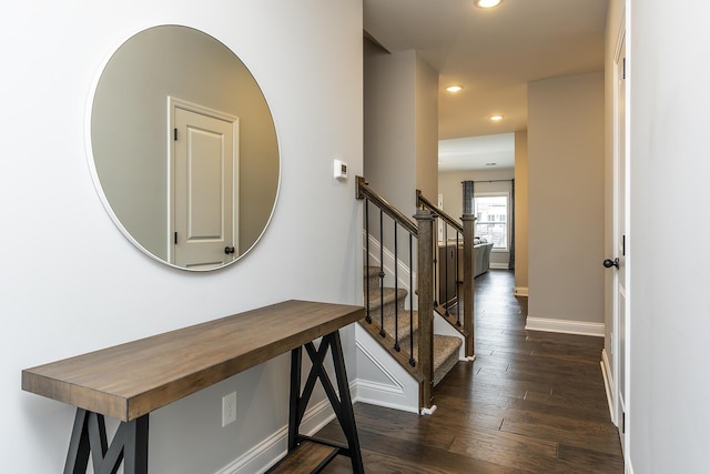 corridor featuring dark wood-style floors, recessed lighting, stairway, and baseboards