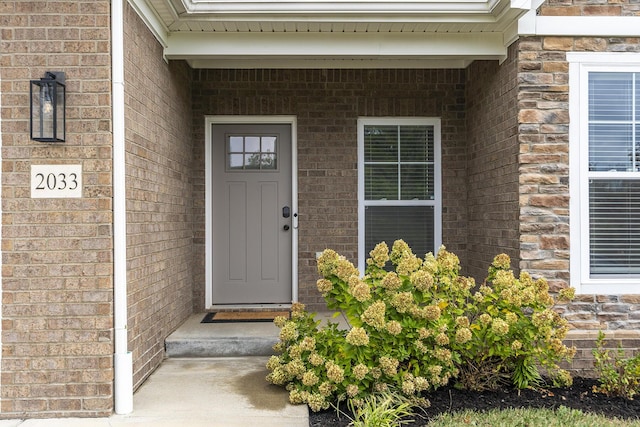 entrance to property with brick siding