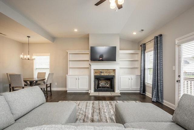 living area with dark wood-style floors, a fireplace, and baseboards