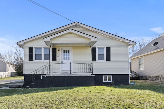 bungalow-style house featuring a front lawn