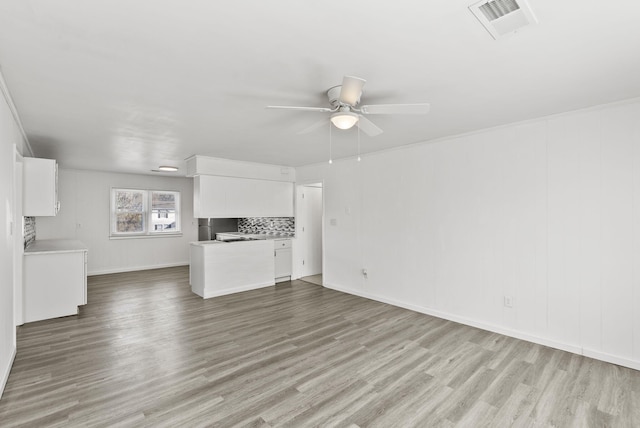 unfurnished living room featuring visible vents, ceiling fan, and light wood finished floors