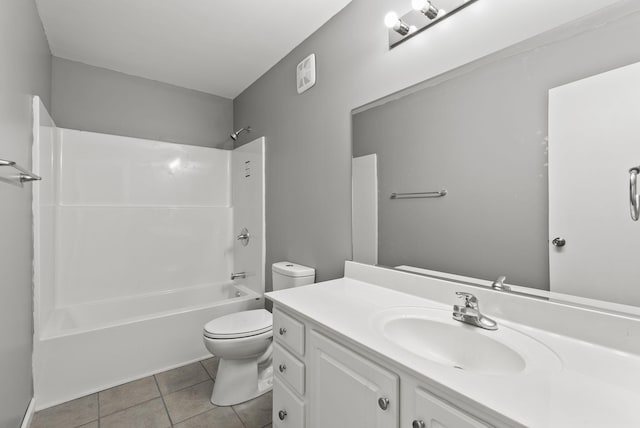 bathroom with toilet, tile patterned flooring, washtub / shower combination, and vanity