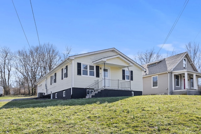 bungalow with a porch, central AC, and a front yard