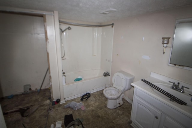 bathroom featuring a textured ceiling, vanity, toilet, and bathing tub / shower combination