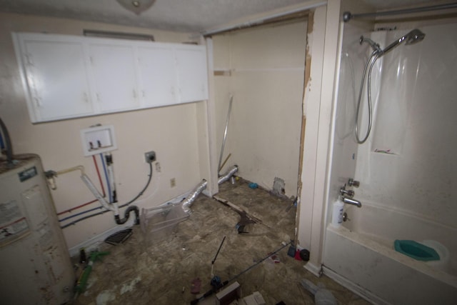 clothes washing area featuring water heater