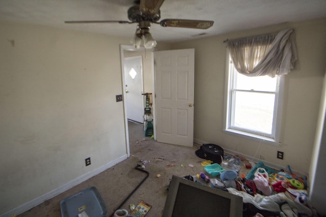 unfurnished bedroom featuring ceiling fan and baseboards