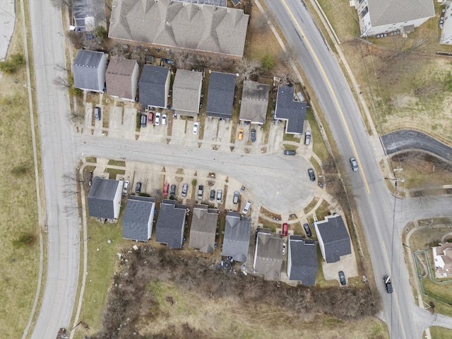 birds eye view of property with a residential view