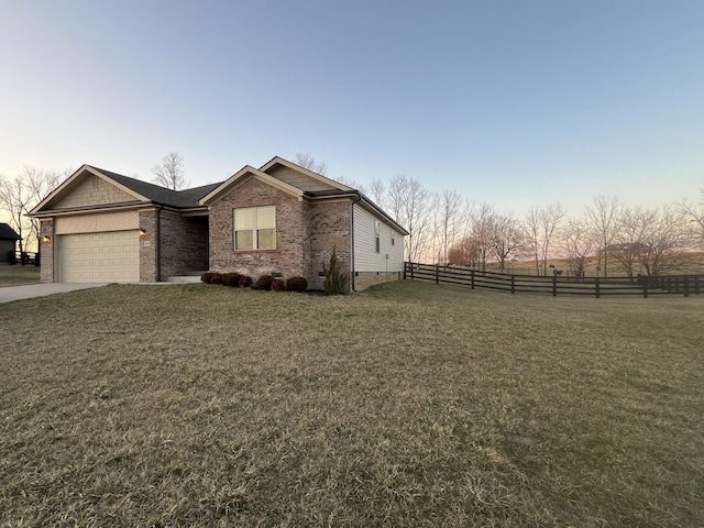 view of front of house featuring a yard, crawl space, brick siding, and fence