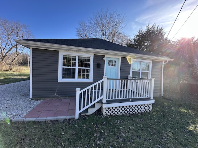 bungalow-style house with a front lawn