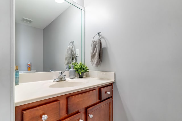 bathroom with visible vents and vanity