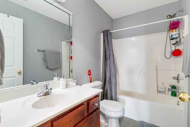 bathroom with shower / bath combination with curtain, tile patterned flooring, vanity, and toilet